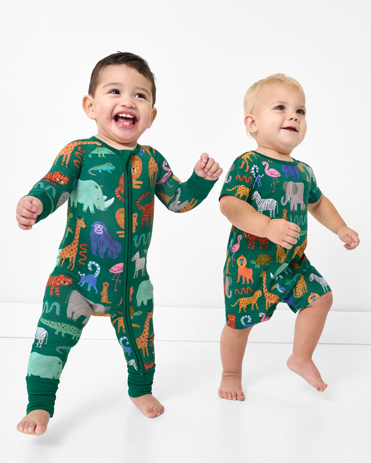 Two walking toddlers wearing matching Wild Zoo styles