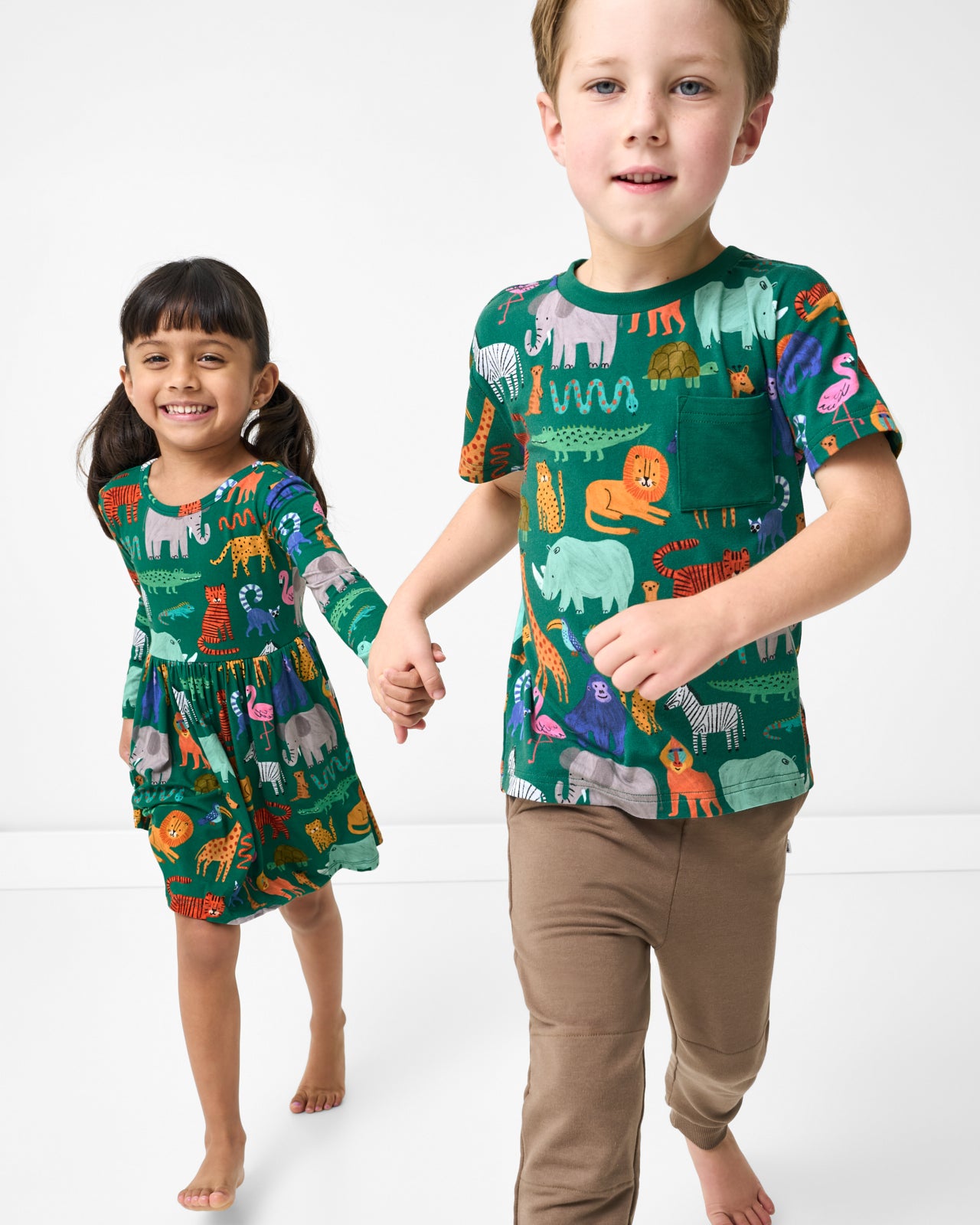 Two kids wearing matching Wild Zoo play styles