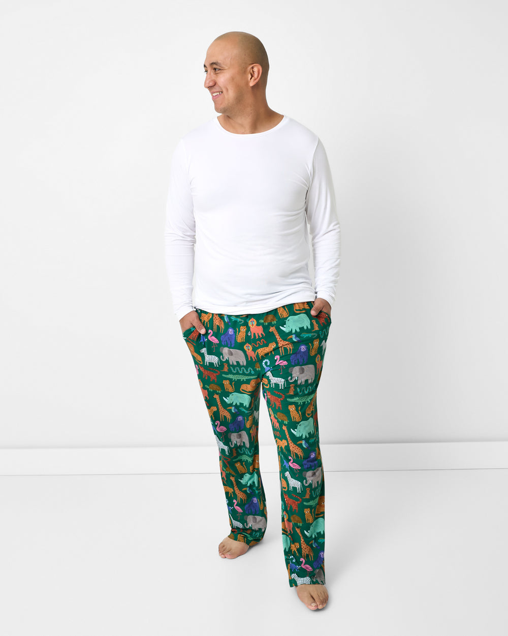 Man wearing the Wild Zoo Men's Pajama Pants with a white PJ top