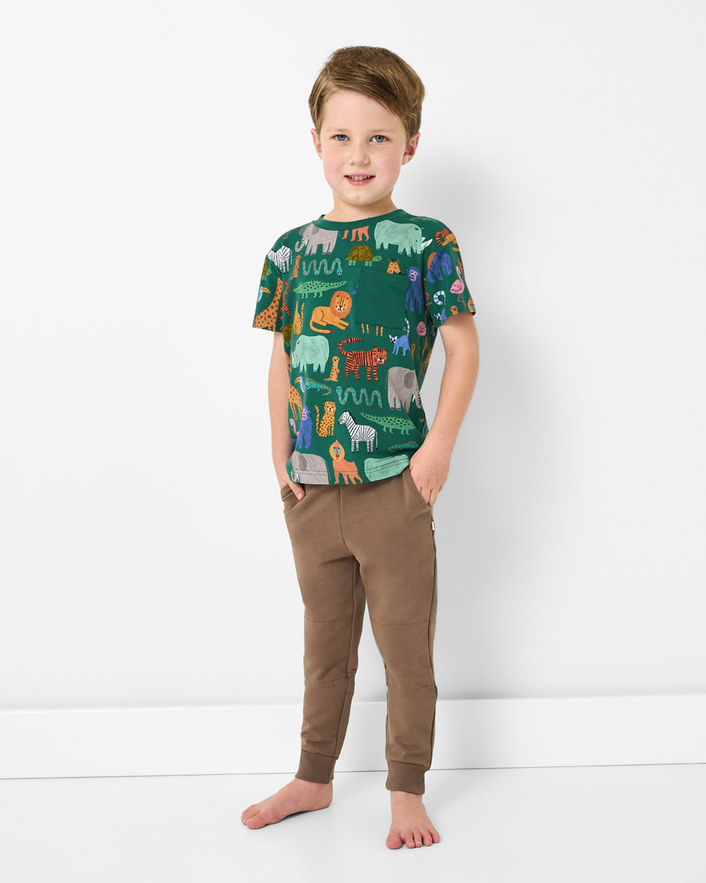 Boy wearing the Wild Zoo Relaxed Pocket Tee with joggers