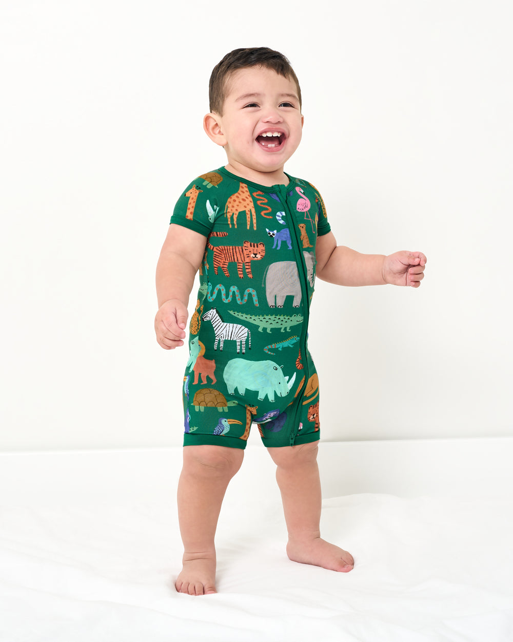 Standing toddler wearing the Wild Zoo Shorty Zipper Pajamas