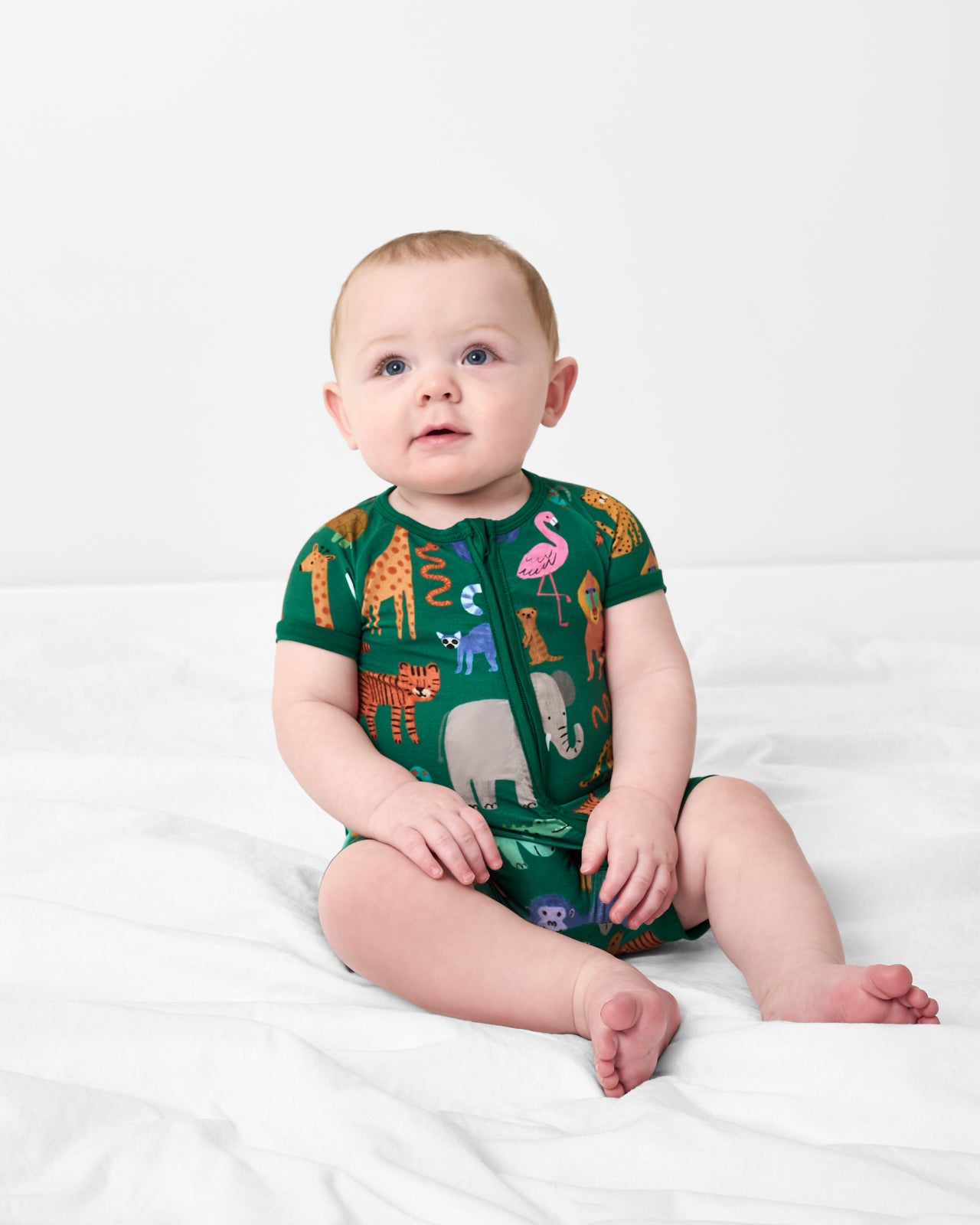 Sitting baby wearing the Wild Zoo Shorty Zippy