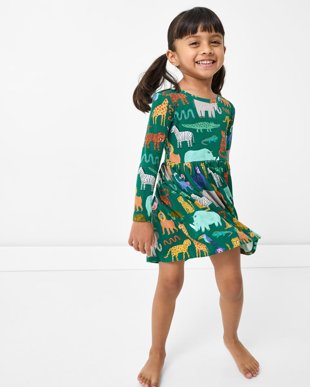 Standing girl wearing the Wild Zoo Skater Dress