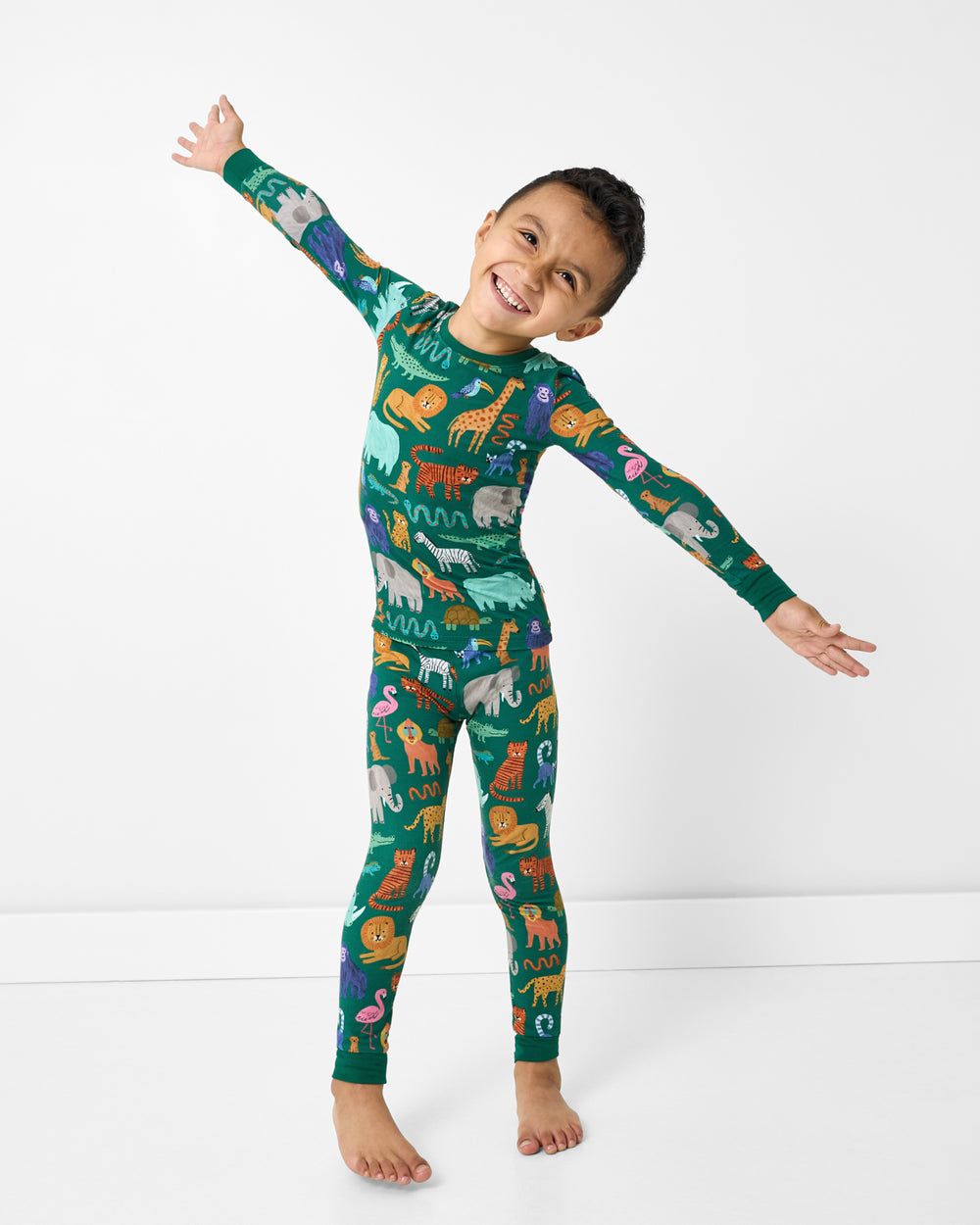 Posing boy wearing the Wild Zoo Two-Piece Pajama Set
