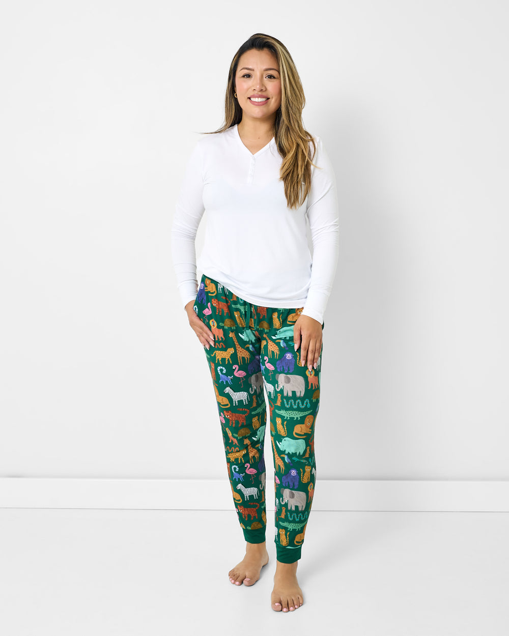 Woman wearing the Wild Zoo Women's Pajama Pants with a white PJ top