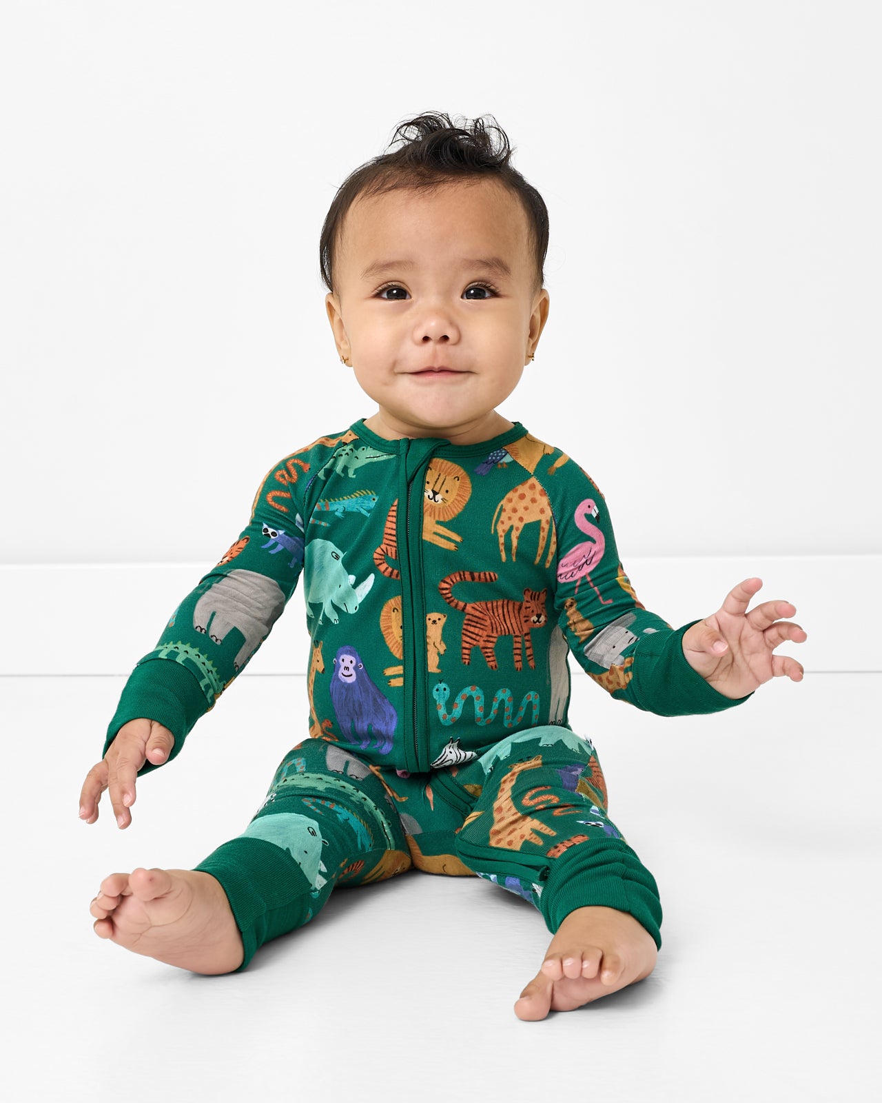 Sitting baby wearing the Wild Zoo Zippy