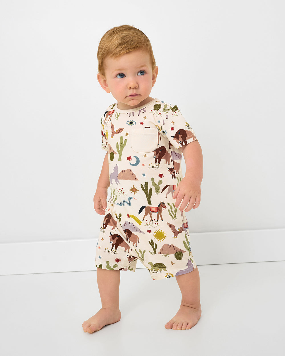 Toddler wearing the Wild Frontier Pocket Shorty Romper