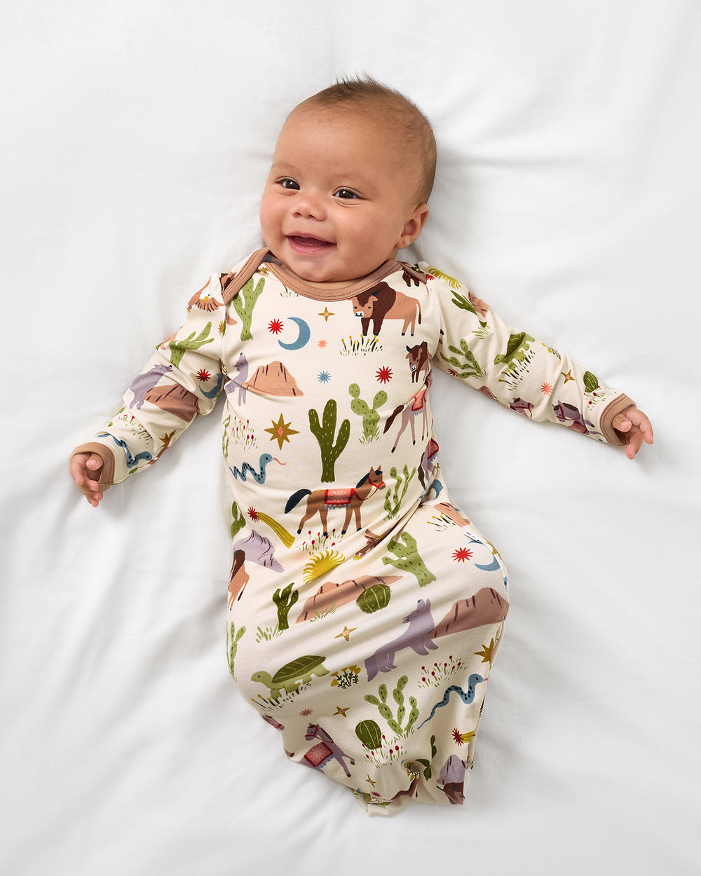 Alternate aerial view of baby wearing the Wild Frontier Infant Gown