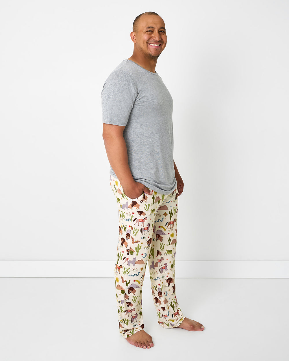 Man wearing the Wild Frontier Men's Pajama Pants with a gray pajama top