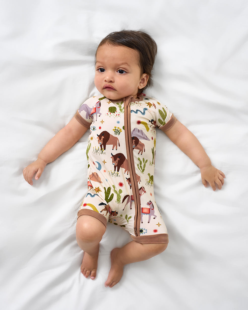 Aerial view of baby wearing the Wild Frontier Shorty Zippy