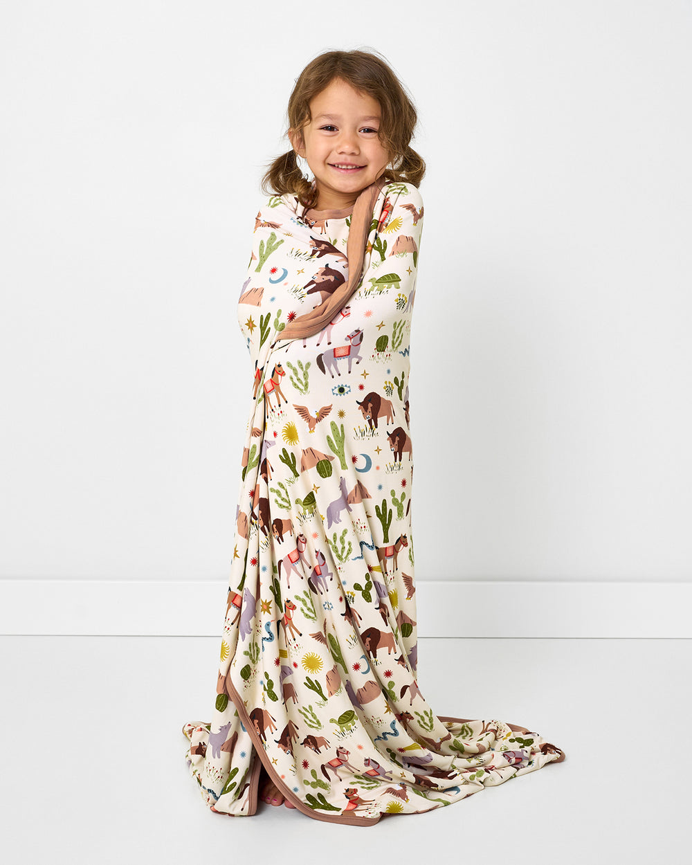 Child wrapped in the Wild Frontier Large Cloud Blanket®