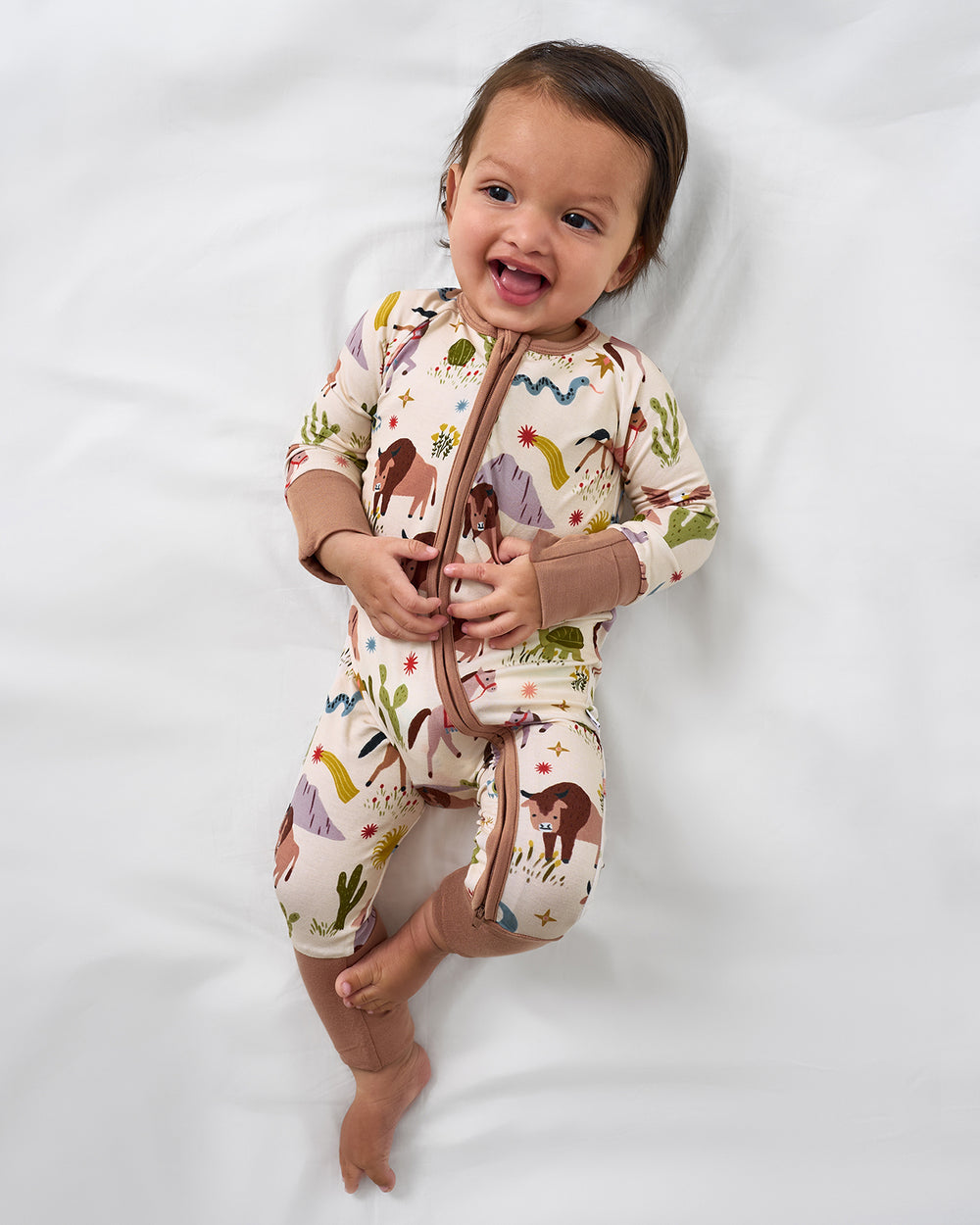 Aerial view of baby wearing the Wild Frontier Zippy