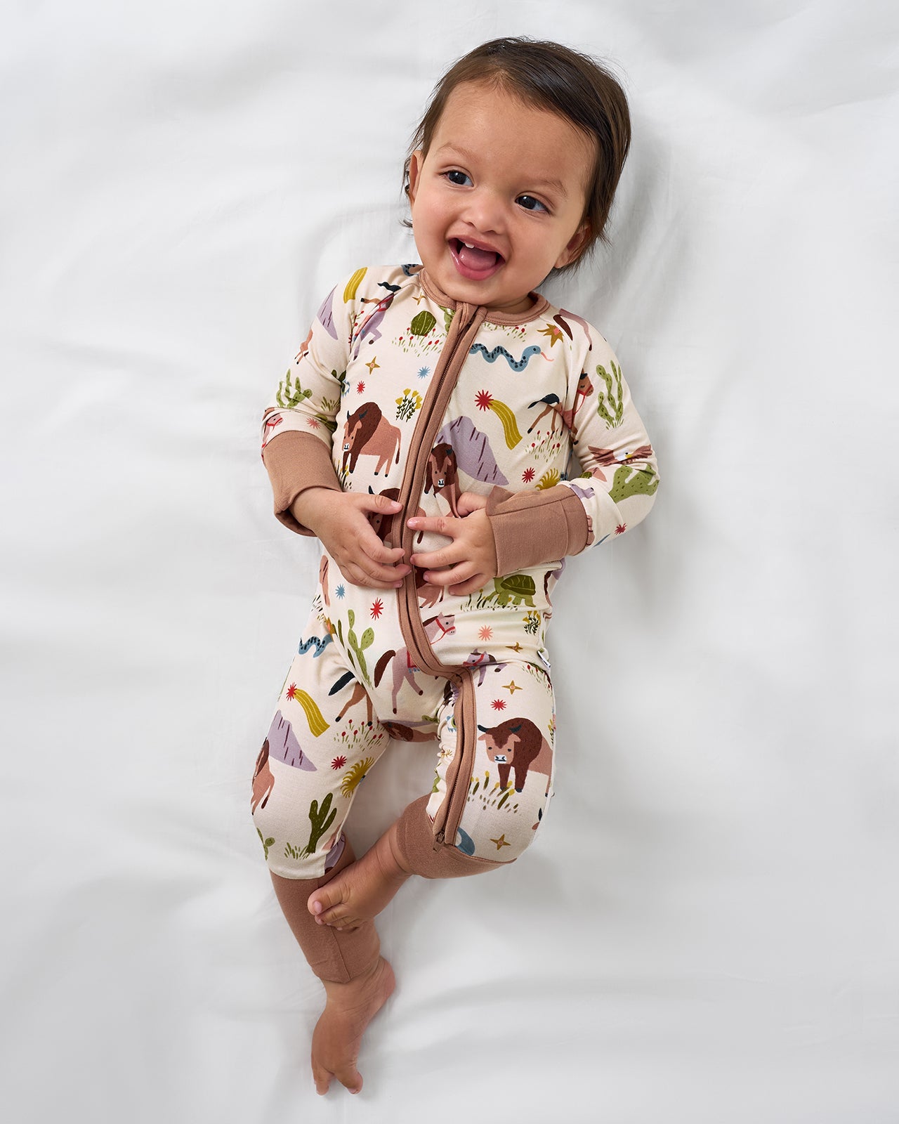 Aerial view of baby wearing the Wild Frontier Zippy