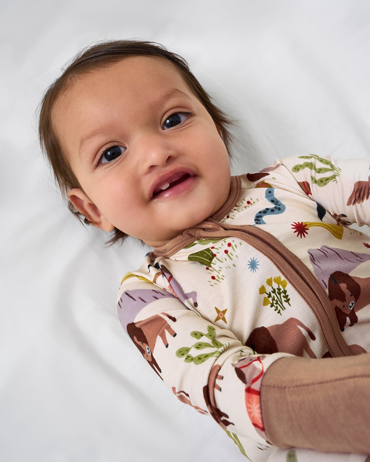 Close up of baby wearing the Wild Frontier Zippy