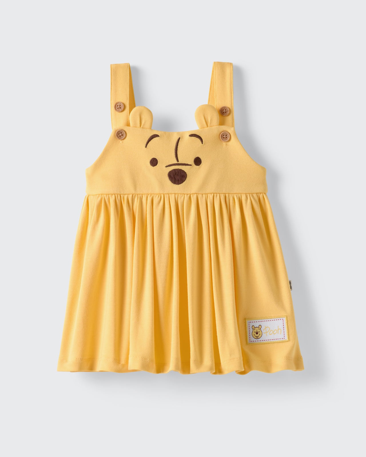 Flat lay of the Disney Winnie The Pooh Overall Dress