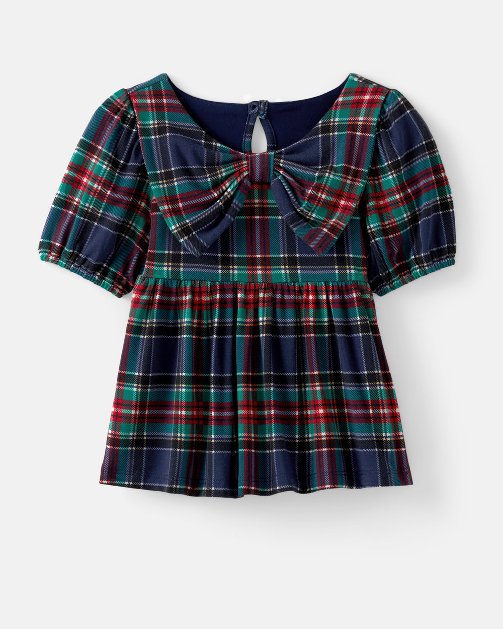 A short-sleeve plaid dress with a large bow at the neckline, featuring a navy blue base with red, green, and white tartan pattern, shown against a light gray background.
