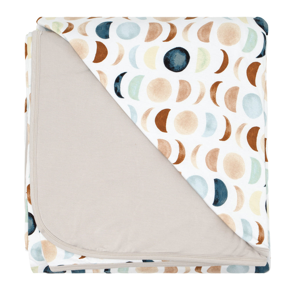 Click to see full screen - Flat lay image of a Luna Neutral oversized cloud blanket showing the solid backing.