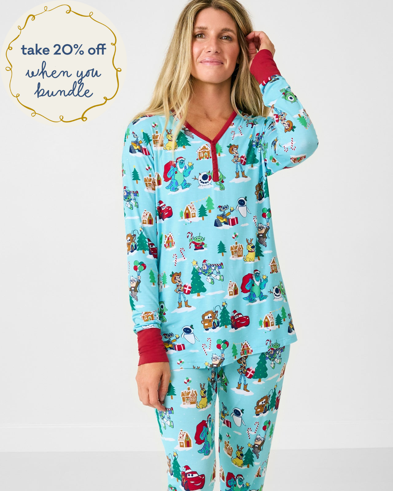 Woman wearing the Disney & Pixar Christmas Village Women's Long Sleeve Pajama Top