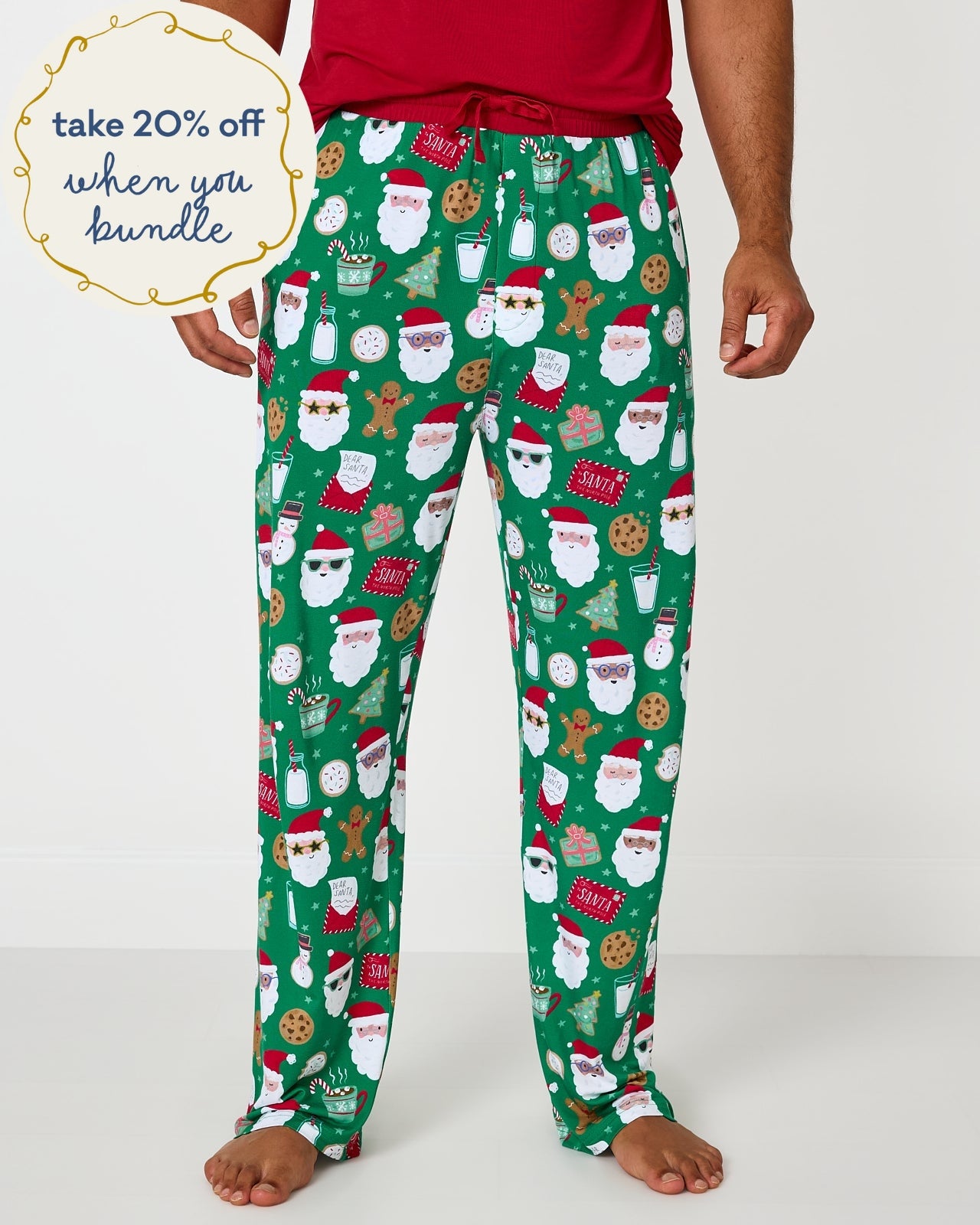 Man wearing the Cookies for Santa Men's Pajama Pants with a holiday red pj top
