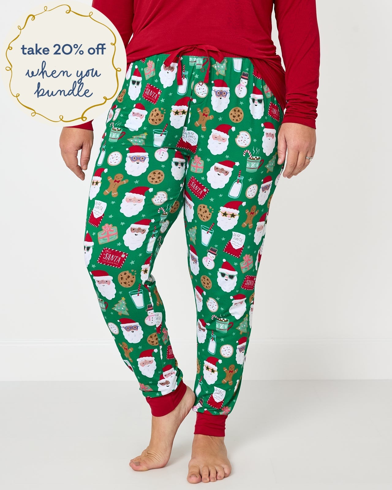 Woman wearing the Cookies for Santa Women's Pajama Pants with a holiday red pj top
