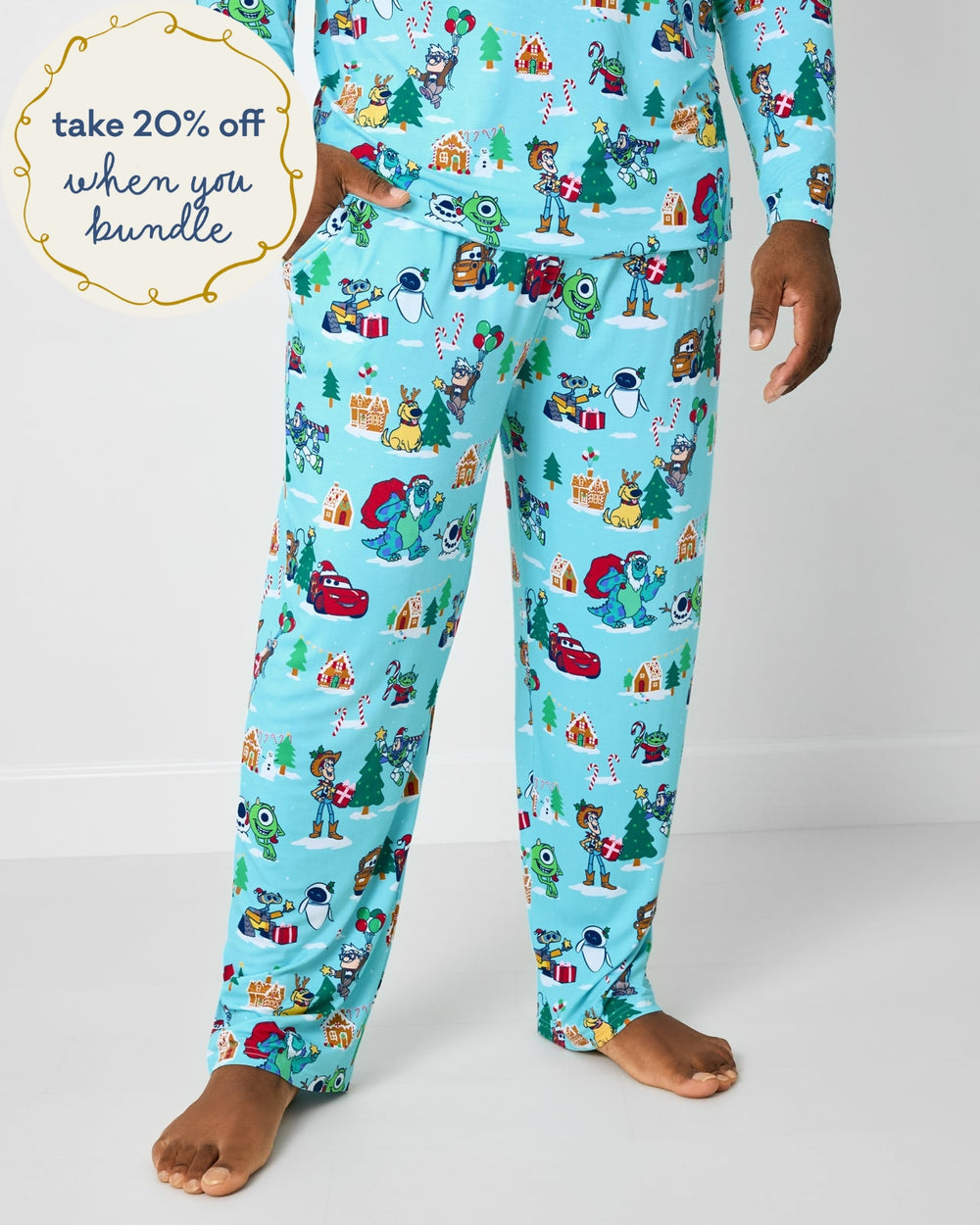 Man wearing the Disney & Pixar Christmas Village Men's Pajama Pants