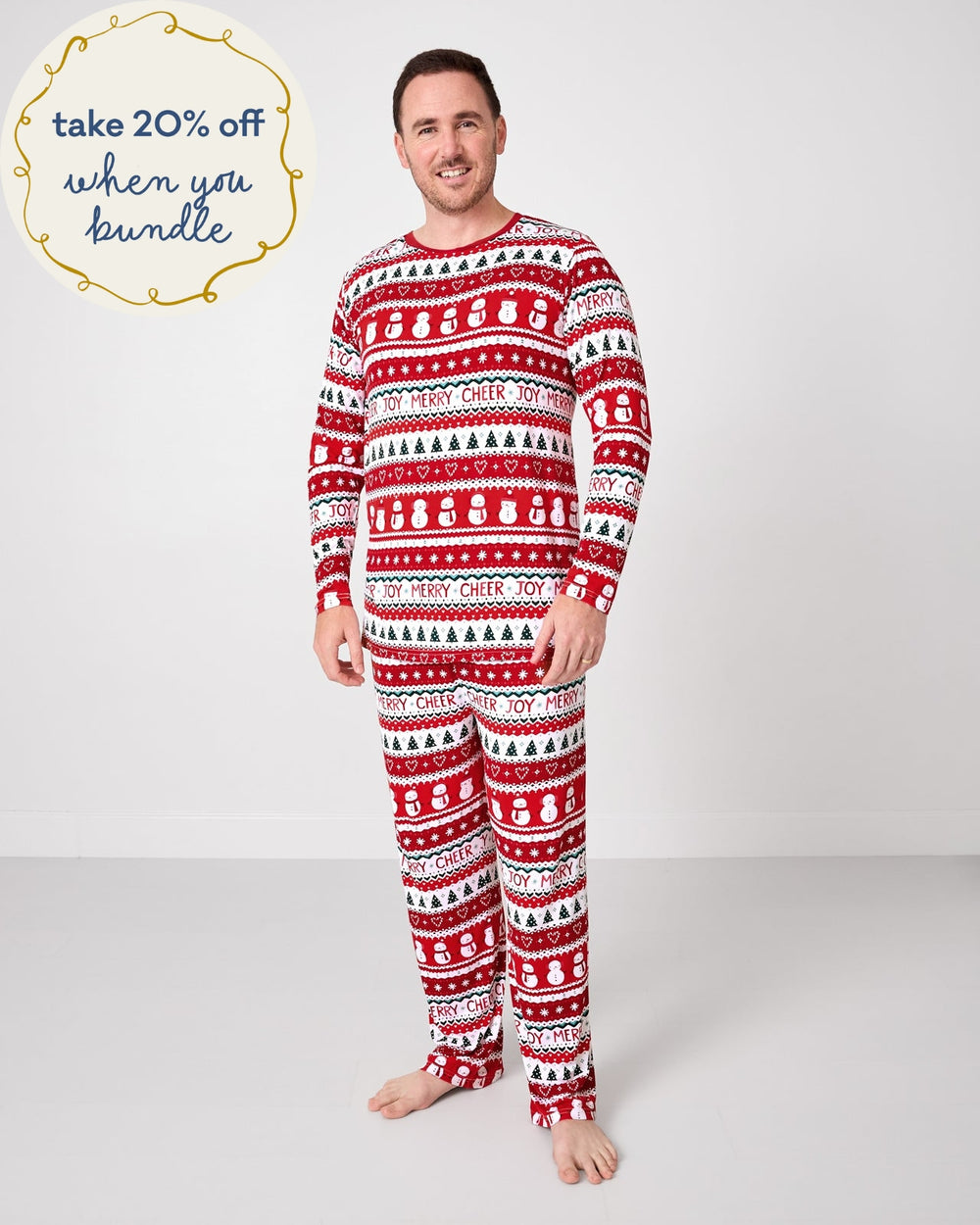 Standing man wearing the Festive Fair Isle Men's Pajama Pants with a matching pj top