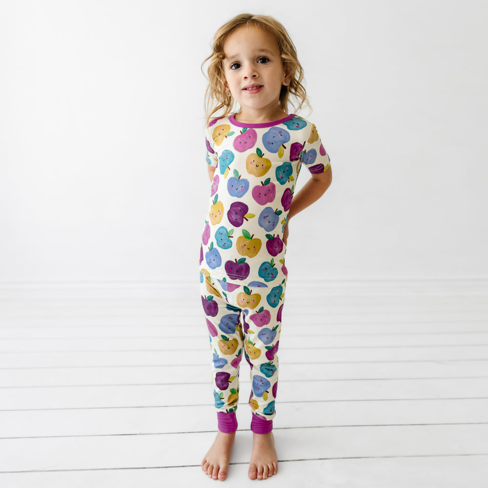 Child wearing a Berry Apple of my Eye two piece short sleeve pajama set