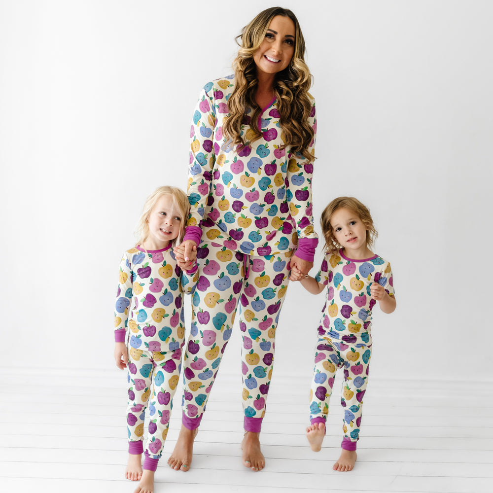 Mom and two children wearing matching Berry Apple of My Eye pajamas