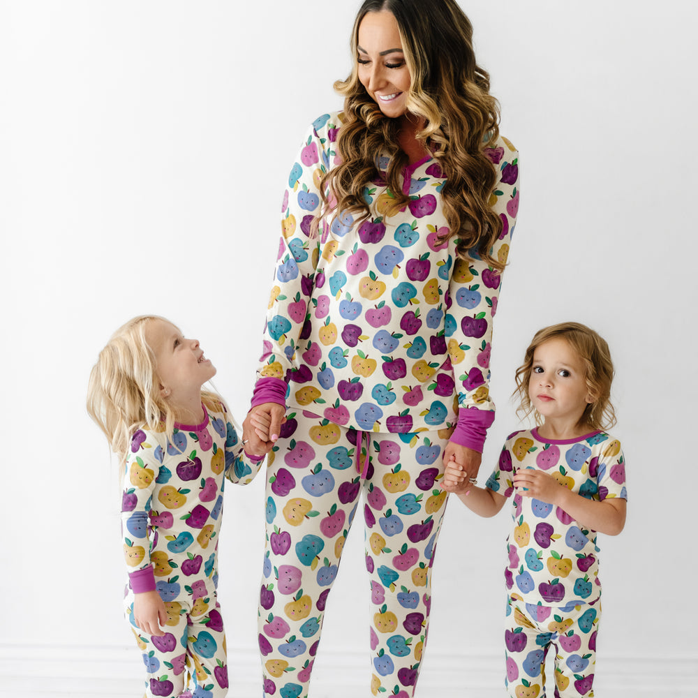 Mother and two children wearing matching Berry Apple of My Eye pajamas