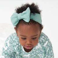 Alternate close up image of a child wearing an Aqua Mist luxe bow headband