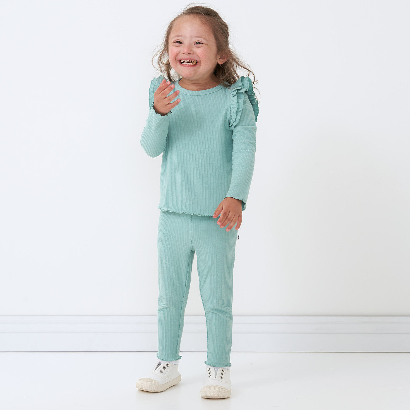 Child wearing a Aqua Mist Ribbed Flutter Lettuce Tee paired with matching leggings