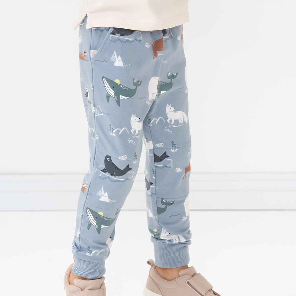 Close up image of a child wearing Arctic Animals printed joggers