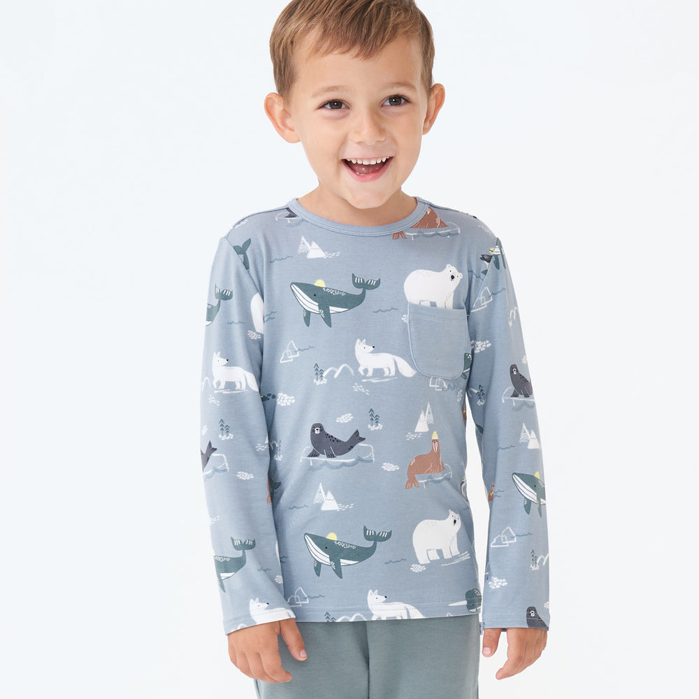 Child wearing an Arctic Animals printed pocket tee and coordinating joggers