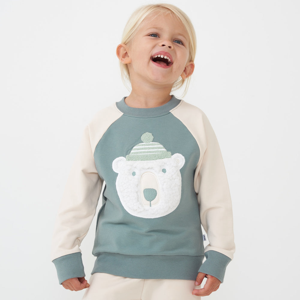 Child wearing a Polar Bear crewneck sweatshirt