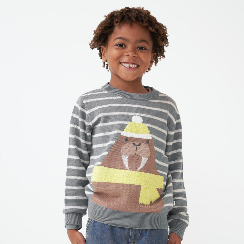 Child wearing a Walrus knit sweater