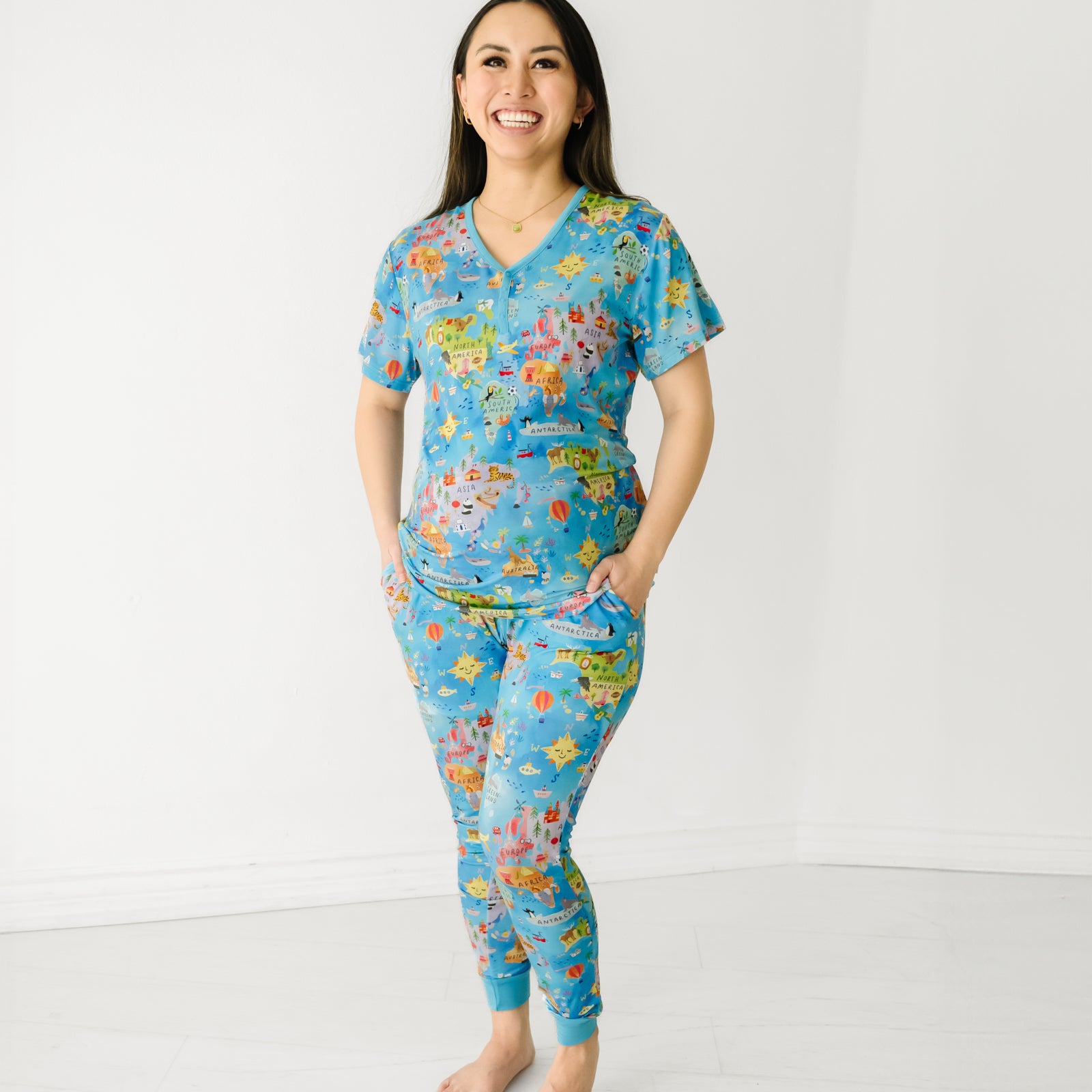 Smiling woman wearing Around the World bamboo women's pajama pants and pajama top