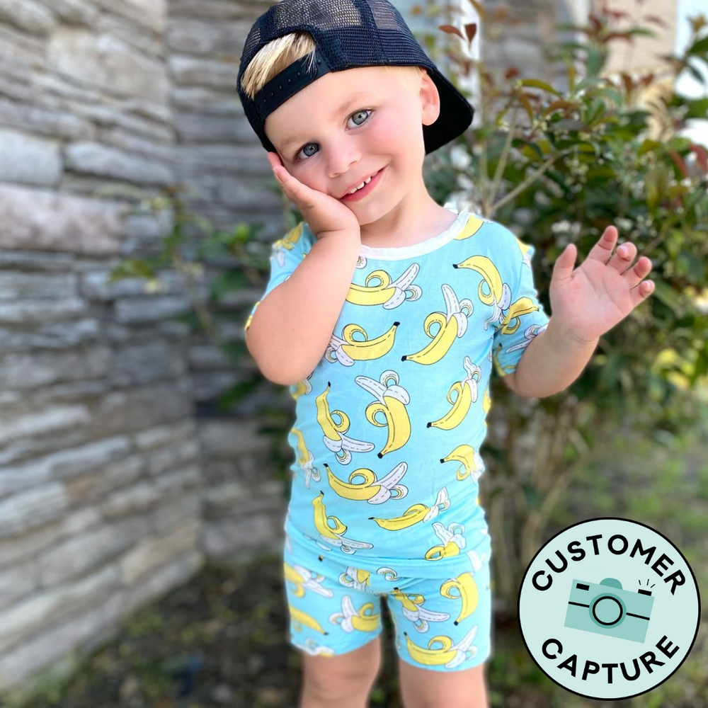 Customer Capture image of a child wearing a Bananas two piece short sleeve and shorts pajama set