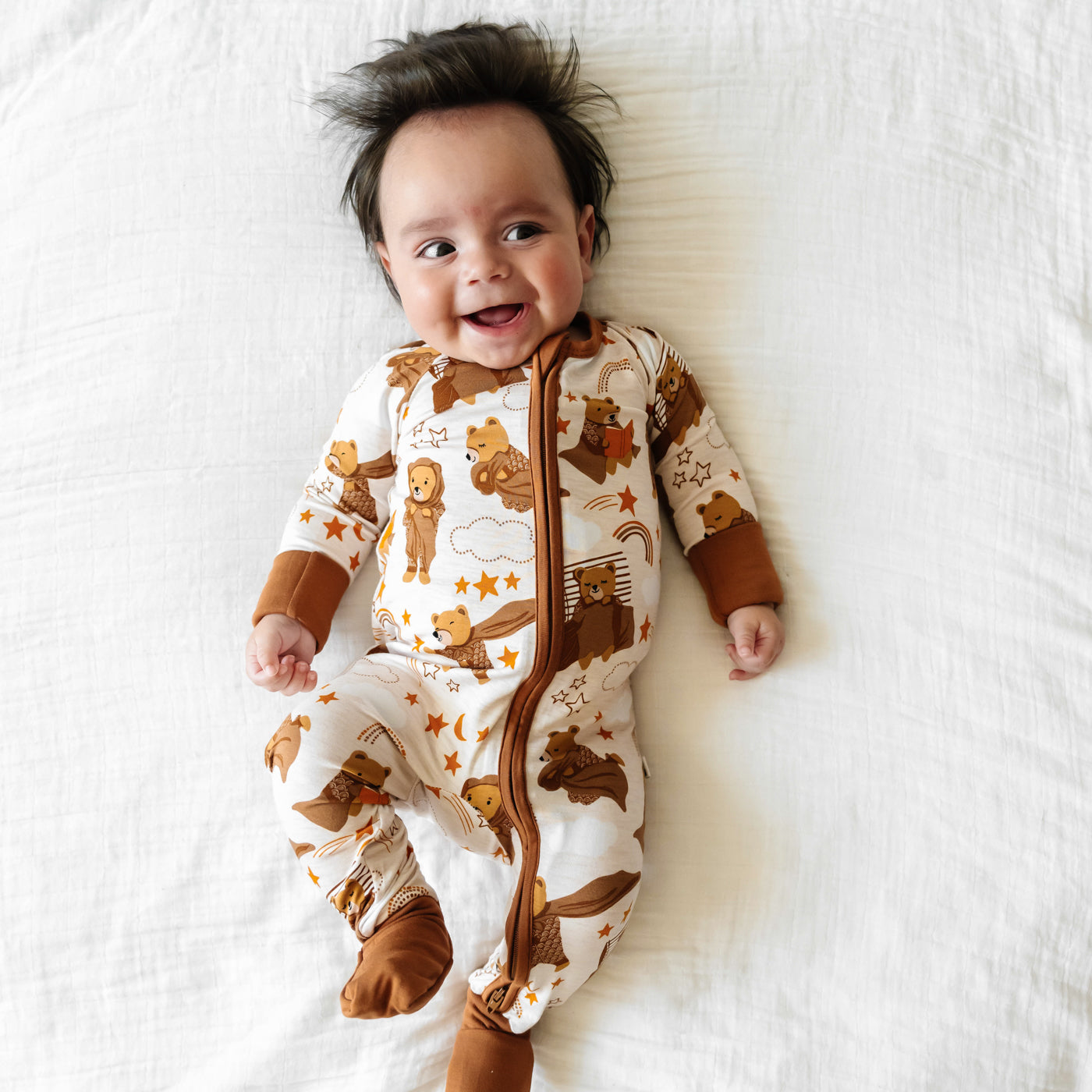 Infant lying down wearing a Beary Sleepy Zippy