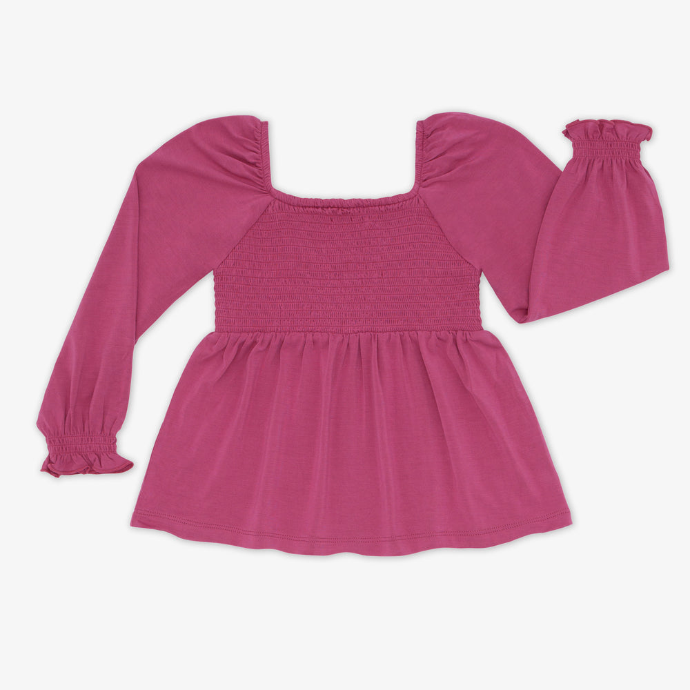 Flat lay image of the Berry Rose Smocked Peasant Top