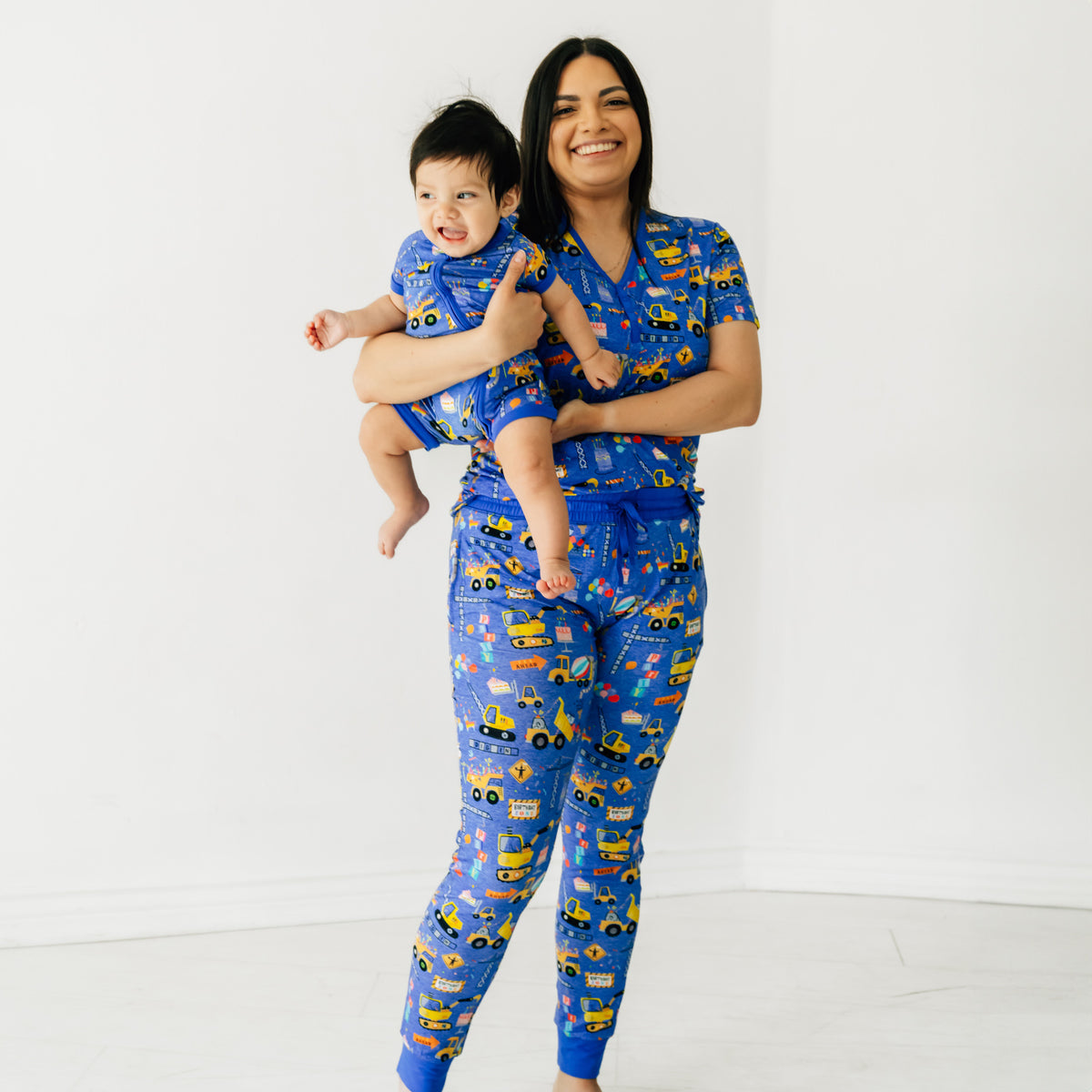 Mother and child wearing Birthday Builders mommy & me matching pajamas