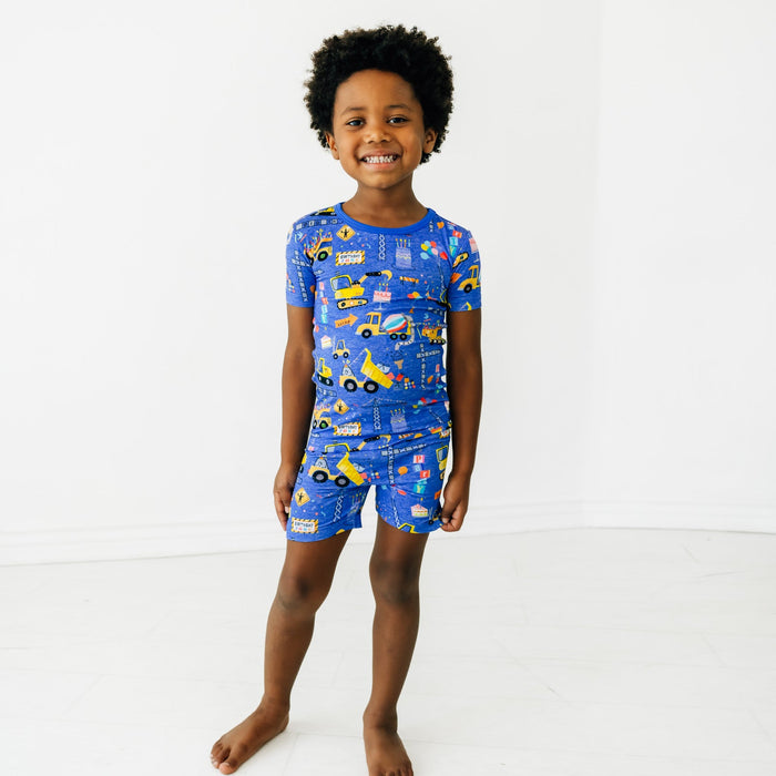 Child wearing a Birthday Builders Two-Piece Short Sleeve and Shorts Pajama Set