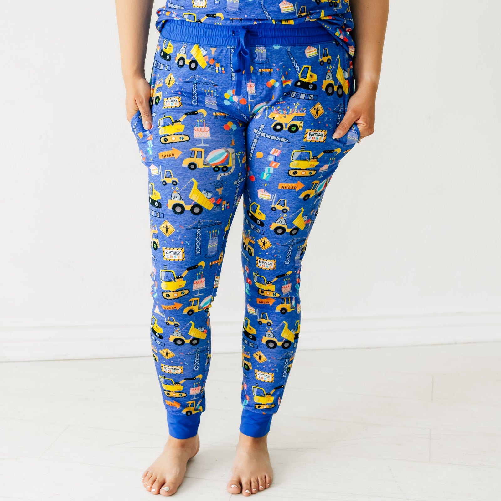 Close up of a woman wearing Birthday Builders Women's Pajama Pants