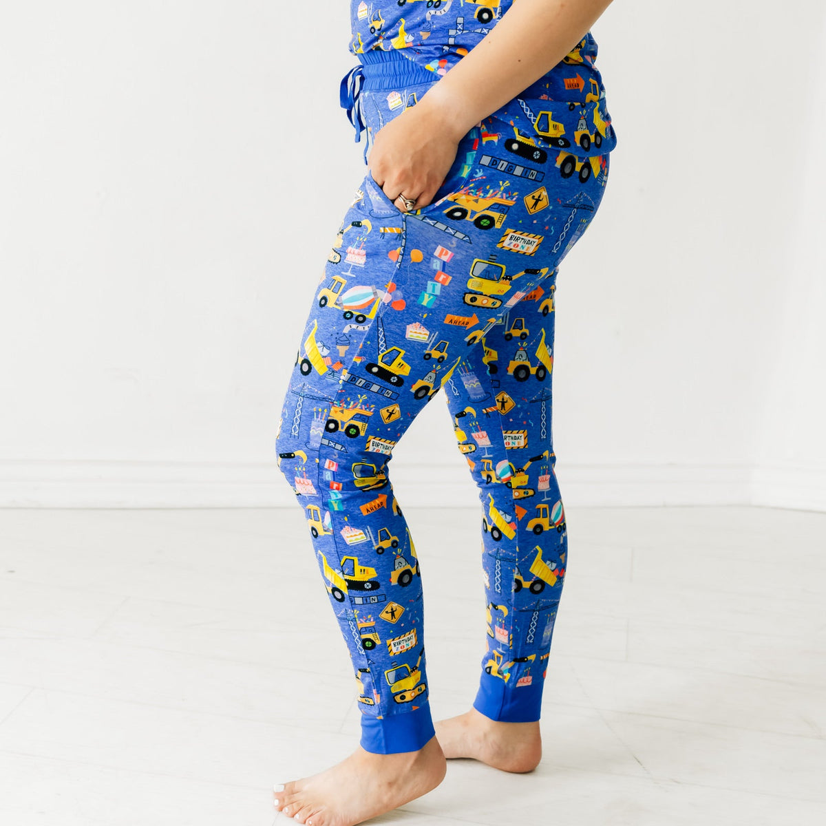 Close up profile view of a woman wearing Birthday Builders Women's Pajama Pants
