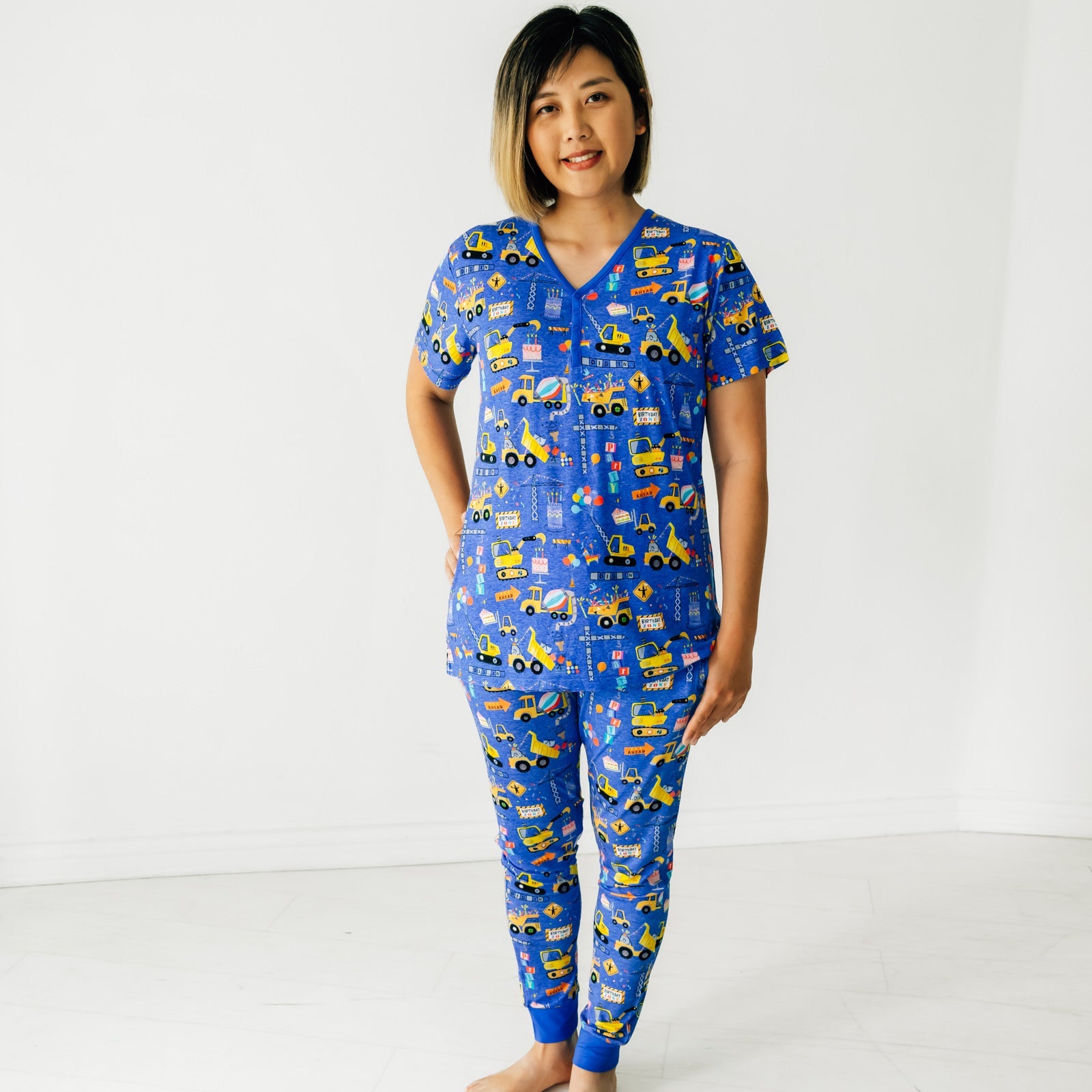 Woman wearing a Birthday Builders Women's Pajama Top and Pajama Pants