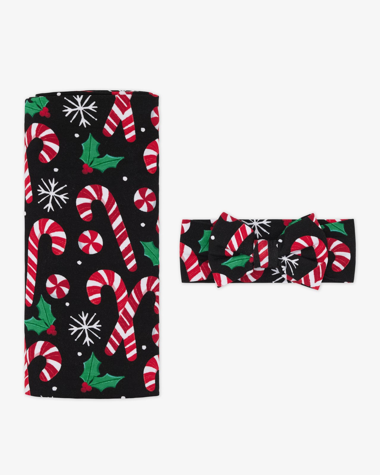 Flat lay of the Merry Mints Swaddle & Luxe Bow Headband Set