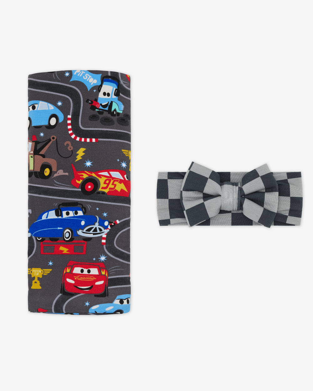 Flat lay of the Disney & Pixar Piston Cup Swaddle & Luxe Bow Headband Set