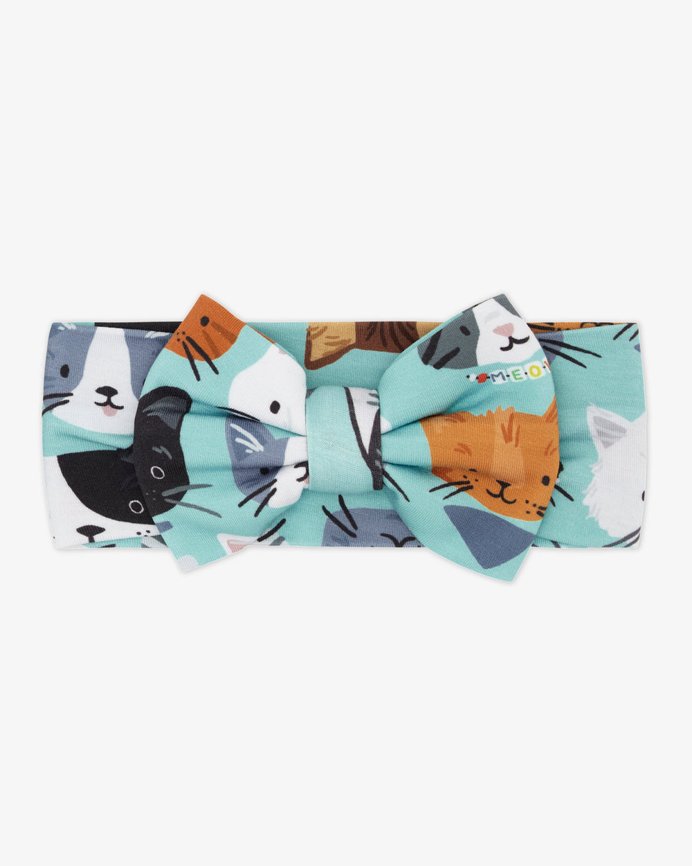 Flat lay of the Purrfect Pals Luxe Bow Headband
