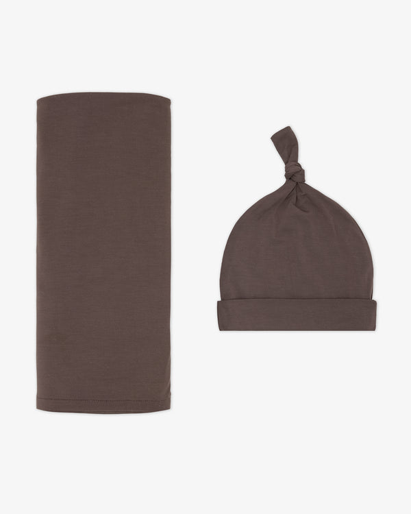 Flat lay of the Dark Chocolate Swaddle & Hat Set