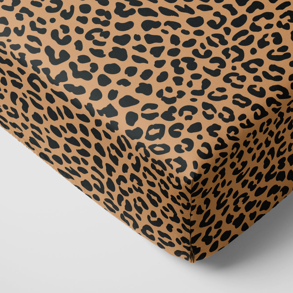 Click to see full screen - Classic Leopard printed fitted crib sheet on a mattress