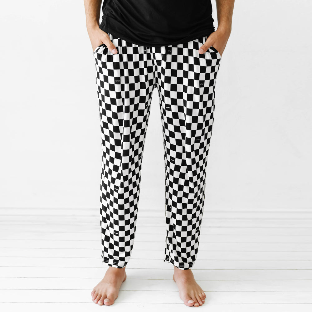 Click to see full screen - close up image of a man wearing Cool Checks printed men's pajama pants showing off the pockets